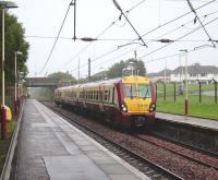 334 012 with a Glasgow Central - Largs service calls at Milliken Park on 20 August.<br><br>[David Panton 20/08/2008]