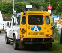 An Aquarius roadrail vehicle stands at the level crossing at the east end of Rogart station on 28 August 2007 awaiting the passage of the 0714 from Inverness to Wick & Thurso. Once the train is clear, the vehicle will mount the rails on the crossing and undertake a PW inspection trip as far as Kildonan.  <br><br>[John Furnevel 28/08/2007]
