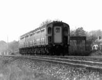 A Weymouth to Bournemouth push-pull service, comprised of a class 33 locomotive attached at the rear of a pair of 4TC sets, photographed at speed near Wareham in May 1977.<br><br>[John McIntyre 20/05/1977]