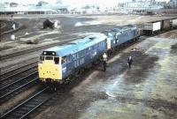 31273 in the process of removing an ailing class 40 from a southbound freight at York in the Summer of 1984. The south end of York station can be seen in the background.<br><br>[Colin Alexander //1984]