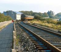 The afternon train from Dublin overtakes a jogger (<I>or should that be... </I> never mind) on the approach to Galway station in 1991. <br><br>[Bill Roberton //1991]