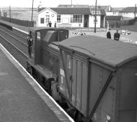 D2437, the Barassie wagon works shunter, out on a foray up the main line prior to propelling its train back into the works yard in the Summer of 1963. [Built by the G&SWR in 1902, the former Barassie carriage and wagon works became a wagon repair facility in 1928 until its eventual closure in 1974.]<br><br>[Colin Miller 23/08/1963]