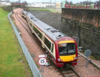 The 1318 from Glasgow Queen Street takes the platform line at Alloa Station Junction on 22 December 2008.<br><br>[John Furnevel 22/12/2008]