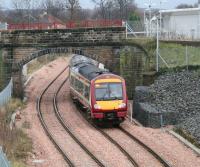 A First ScotRail service arriving from Glasgow Queen Street passes east under the bridge that once carried the 1760s Alloa Wagonway as it runs into the platform at Alloa station on 22 December 2008. <br><br>[John Furnevel /12/2008]