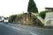 <I>Excuse me, does my abutment look big in this?</I> The remains of the former P&BDR bridge on the south side of Barshaw Drive, Paisley, now forming part of the boundary wall of the flats in the background. <br><br>[Colin Miller //2004]