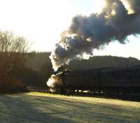 View into the winter sun showing 80105 at the head of <I>Santa's Polar Express</I> from SRPS Boness on 6 December 2008.<br><br>[Brian Forbes 06/12/2008]