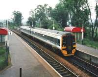 View south over Bridge of Allan station towards Stirling in June 1998, as ScotRail unit 158 724 arrives with a Dunblane service. <br><br>[David Panton /06/1998]