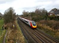 A southbound Pendolino approaches the footbridge alongside the site of Barton & Broughton station, Lancs, on 24 January 2009.<br><br>[John McIntyre 24/01/2009]