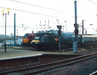 Grand Central HST power car 43123 passes EWS 67002 <I>Special Delivery</I> at the west end of Newcastle Central on 31 January 2009, (destination unknown).  <br><br>[Colin Alexander 31/01/2009]