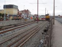 The Blackpool and Fleetwood tramway relaying is currently (Feb 09)concentrated on the reserved section between the two carriageways in Cleveleys. This view is south towards Blackpool and shows the contractor's rail mounted crane with new track in evidence. <br><br>[Mark Bartlett 17/02/2009]