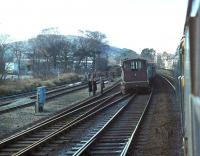 <I>Oops - and not an orange jacket in sight</I>. Brush Class 47, 47463, heading for Holyhead with a passenger train, creeps gingerly past a derailed brake van and coal trucks at Colwyn Bay. My records show the loco in charge of the freight was a Class 40, 40031, the former <I>Sylvania</I>, which was withdrawn two months later. The Class 47 lasted a further 14 years and both were dismantled in Crewe Works.<br><br>[Mark Bartlett 15/03/1981]