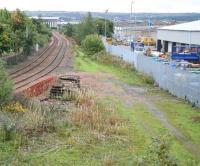 View south from Station Road, Grangemouth, towards Fouldubs Junction on 23 September 2008. The long demolished station stood to the right, while the trackbed running below the camera position carried lines under the A904 into Grangemouth Docks directly behind the photographer. A local campaign has recently got underway to lobby for the return of train services to the town.<br>
<br><br>[John Furnevel 23/09/2008]