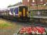 High summer and typical tourist weather greets people to this popular resort as a class 156 stands at Whitby in August 2008<br><br>[Ian Dinmore 02/08/2008]