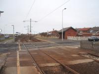 It is unusual to see rusty tracks on the tramway to Fleetwood but this section was closed during winter 2008/09 for refurbishment, including track renewal. Rossall School halt is the point where the tramway swings away from the roadside to cross the peninsula and then join the main street through Fleetwood town centre. View north towards Fleetwood.<br>
 [See image 44214]<br><br>[Mark Bartlett 17/02/2009]