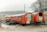 Withdrawn Glasgow Subway stock at Beamish in 1979. The six redundant units had been obtained 2 years previously and were intended for use by the museum in the construction of replica tramcars. What eventually happened to the idea,... or the cars themselves, is not known.<br><br>[Colin Miller //1979]