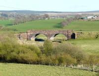Twin arch bridge adjacent to the hamlet of Caldermill, on the former Caledonian route between Strathaven and Ryeland, Lanarkshire, photographed in April 2009. This section of the line was closed completely in 1951.<br><br>[Ken Browne 21/04/2009]