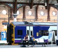 Northern 158792 stands in bay platform 1 at York on 22 April 2009 forming the next train for Hull. Meantime, two relaxed looking ladies enjoy the sunshine on platform 3, while awaiting the arrival of a southbound ECML service.<br><br>[John Furnevel 22/04/2009]