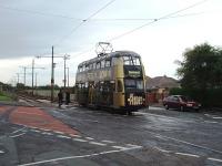 Most of the Blackpool tramway follows the main coastal road but at Rossall School the trams veer North East to run across the peninsula and access Fleetwood's main street. Here No. 721, a double deck car in advertising livery heading for Fleetwood, runs into Broadwater, part way along that section of the line.<br><br>[Mark Bartlett 10/06/2009]