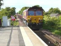 PW train number 8K63 at Kilmaurs on 13 June 2009 with EWS locomotive 66122 nearest the camera. Various engineering activities were being undertaken along the line over the weekend, including replacement of drains, points installation and platform work at Dunlop, involving some 8 separate trains. <br><br>[Ken Browne 13/06/2009]