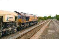 EWS 66017 takes a train of Lafarge aggregates south on the Midland Mail line through Sileby on 22 June.<br><br>[Peter Todd 22/06/2009]