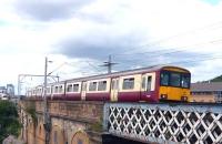 A 318 emu heads west along Yorkhill viaduct on 5 July 2009.<br><br>[Colin Miller 05/07/2009]