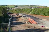 The temporary road from the site of Polkemmet Jct to bypass the overbridge on the Whitburn Road takes shape in late May 2009. <i>Bathgate Academy</i> in the background.<br><br>[James Young 30/05/2009]