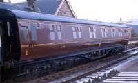 12 wheel 1st Class sleeping car built at Wolverton in 1952 to LMS design, lot 1584 and numbered M394M stands at Boat of Garten in 1973 having been preserved in LMS livery.<br><br>[John McIntyre //1973]