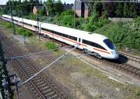 A Hamburg-Lubeck ICE approaching the bridge under Moislinger Ailee near Lubeck station on 20 July 2009. Two days later another ICEtrain suffered major damage when children placed concrete blocks and iron fencing on the track.<br>
<br><br>[John Steven 20/07/2009]