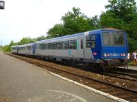 The heavily loaded 19.09 3-car DMU service to Sarlat, ex-Libourne, with car 2221 at the rear, offloads at Velines Station on 13 July 2009. Two reminders of home on the rear of and to the right of the last coach.<br><br>[David Pesterfield 13/07/2009]