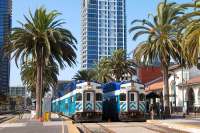 San Diego <I>Coaster</I> car cab units no 2302 and 2310 stand at the Santa Fe Depot in downtown San Diego, CA on 18 August 2009. A <I>Coaster</I> set typically consists of a locomotive and 5 or 6 double-deck coaches. The service links San Diego and Oceanside, CA to the north. A one-way trip takes about 60 minutes and stops are made at 6 intermediary stations along the line.<br><br>[Andy Carr 18/08/2009]