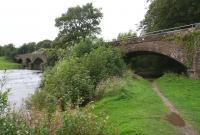 View over the Nith from the pathway on the east bank of the river on 1 September showing the bridge that once carried the Dumfries - Stranraer line. The bridge was refurbished and reopened in July 2008 as the <I>Queen of the South Viaduct</I> for the use of pedestrians and cyclists as part of the Maxwelltown Railway Path. The route follows the trackbed west as far as Cargenbridge Viaduct [See image 15525]<br>
<br><br>[John Furnevel 01/09/2009]