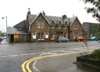 View west across the A711 St Mary's Street, Kirkcudbright on a rainy afternoon in August 2009. The stately old building is the 1864 terminus of the Kirkcudbright Railway. The main  part of the old station (closed in 1965) now houses a <i>Beauty and Fitness Studio</i>, while the small structure on the corner of the block, once the station toilets,  is now the home of the local bookies. (Subliminal message there perhaps?)   <br>
<br><br>[John Furnevel 31/08/2009]