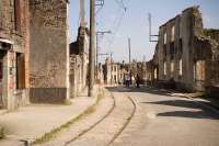 The historic village of Oradour, France, showing the old village tram line and overhead wires. Oradour was destroyed by the Waffen SS on 10 June 1944 in reprisal for Resistance attacks. The village has been left as a memorial to that day.<br>
<br><br>[Peter Todd 12/09/2009]