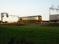 Freightliner 66570 held at signals south of Winsford Station on Intermodal working <br><br>[David Pesterfield 09/09/2009]