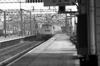 A northbound WCML express with a Class 86 rushes through Watford Junction on 20 March 1976.<br><br>[John McIntyre 20/03/1976]