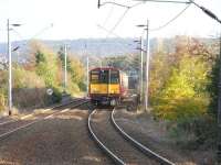 314 202 approaches the (clearly) island platform at Langside with an Outer Circle working on 28 October 2009.<br><br>[David Panton 28/10/2009]