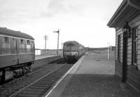 The mid afternoon Elgin-Cairnie Junction DMU waits to cross an Aberdeen-Elgin DMU at Portessie on 2nd May 1968. <br><br>[David Spaven 02/05/1968]