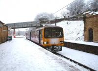 Wintry conditions as Northern Pacer 144011 arrives in Platform 5 at Lancaster prior to reversing for Morecambe. Despite the falling snow, which continued to affect public transport across Britain, this service, which had travelled via Skipton and Bentham, was only running around 20 minutes late. <br><br>[Mark Bartlett 05/01/2010]