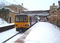 Having connected with southbound WCML trains on the opposite side of Lancaster's island platform 144011 is ready to continue its journey from Leeds to Morecambe. The snow ceased soon afterwards and compared to many other areas Lancaster <I>got off lightly</I>. <br><br>[Mark Bartlett 05/01/2010]