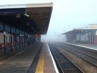 Although Barrow is a comparitively modern station, it was eerily quiet between trains on this cold January day when the fog never lifted. Three platforms remain in use, including the two through roads shown and a bay for northbound trains only behind the buildings on the right. <br><br>[Mark Bartlett 23/01/2010]