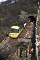 A southbound HST creeps out of Penmanshiel Tunnel on 15 March 1979, two days before the tragic tunnel collapse in which two men died. (The tunnel works were being undertaken to increase the line's loading gauge to accommodate the new generation of containers.)  As the tunnel was in such a dangerous condition following the collapse, the line was subsequently rerouted and the tunnel sealed, with the men's bodies left entombed. A memorial now stands on the hillside above the tunnel. [See image 28041]<br>
<br><br>[Frank Spaven Collection (Courtesy David Spaven) 15/03/1979]