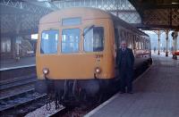 Driver Ronnie Guthrie poses next to a Perth - Dundee service DMU which is about to set off on 25 January 1989.<br><br>[Ewan Crawford 25/01/1989]