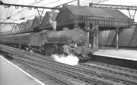 Thompson B1 4-6-0 no 61272 stands with a train at Sheffield Victoria in the 1960s. The station was closed to passengers in 1970 and has since been demolished [see image 7126].<br><br>[Robin Barbour Collection (Courtesy Bruce McCartney) //]
