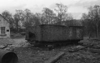 The body of a tender, which was donated to the Strathspey Railway when Lochgorm Works in Inverness was redeveloped, is seen at the Aviemore shed site in April 1979. It was evidently a 'lost cause' and was sent to landfil as it wasn't suitable for scrap.<br><br>[John McIntyre /04/1979]