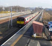 Most trains at Cardonald are whoosing through on their way to and from Ayrshire destinations running non-stop between Glasgow and Paisley, managing briefly to drown out the roar of the M8 which runs parallel to <br>
the lines. Every hour however two of the three services to Gourock call <br>
at the (almost) inseparable trio of Cardonald, Hillington East and <br>
Hillington West. On 17 February 314 209 pulls in heading west.<br>
<br><br>[David Panton 17/02/2010]