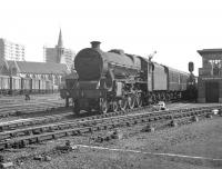 Jubilee no 45663 <I>Jervis</I> arrives at Doncaster station on 20 July 1963 hauling the 1.48pm Skegness - Hebden Bridge. Note the changing skyline around the distinctive <I>Church of St James, Doncaster</I>, in the background. The 1858 church, built to cater for the spiritual needs of the expanding population of the town (brought about by the arrival of the railway) was financed primarily by shareholders of the Great Northern.<br><br>[K A Gray 20/07/1963]
