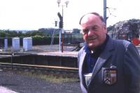 The Reverend Brydon Maben of Waverley Route fame, seen against a background of Border hills and Berwick's station platforms on 17th August 1993. [See image 18723]<br><br>[David Spaven 17/08/1993]