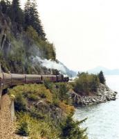 <I>Royal Hudson</I> 4-6-4 no 2860 heads south along the Pacific coast of British Columbia in 1988 shortly after leaving Squamish with a special returning to Vancouver. <br>
<br><br>[John Furnevel //1988]