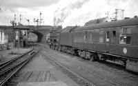 One of the St Rollox batch of BR Caprotti class 5s no 73149 takes a Dundee train out of Buchanan Street in 1964<br><br>[K A Gray //1964]