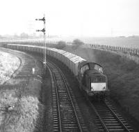 Clayton no 8579 approaches Niddrie West Junction from Niddrie North in February 1970 with Edinburgh area trip working E18 carrying grain from Leith South to Gorgie. Despite the rather primitive <I>Leith General Warehousing</I> wooden bodied stock, this must surely qualify as a block working! The trackbed of part of the Lothian Lines can be seen on the left.<br>
<br>
<br><br>[Bill Jamieson 04/02/1970]